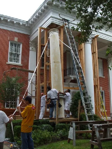  Before, in progress. Columns delivered; lifting of first column.  