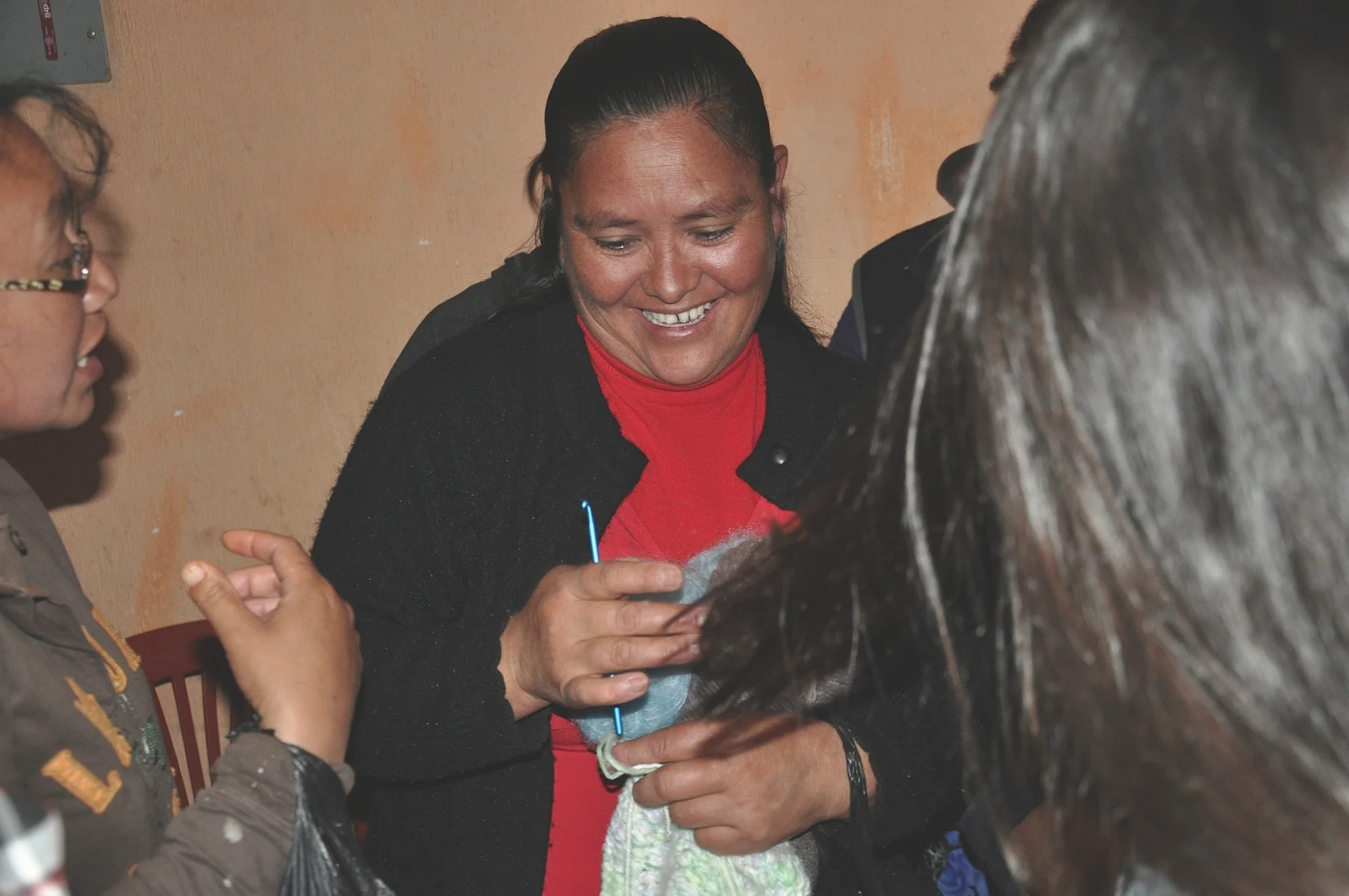  Women receiving a new supply of yarn. 