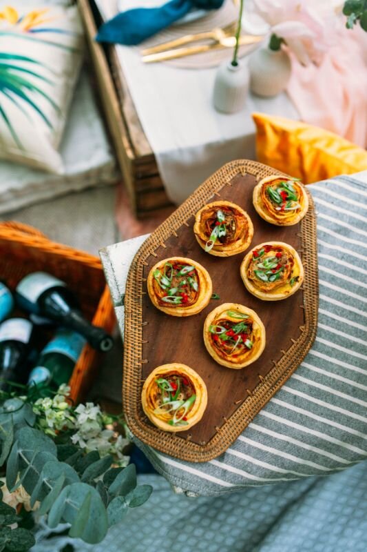 Dita Rosted Events - Boho Wedding Picnic London - Pillar Candle - Parisian Blue napkin - Nordic Stoneware Plate - Gold cutlery -Apple crate table - Tropical cushions -Photo-75.jpg