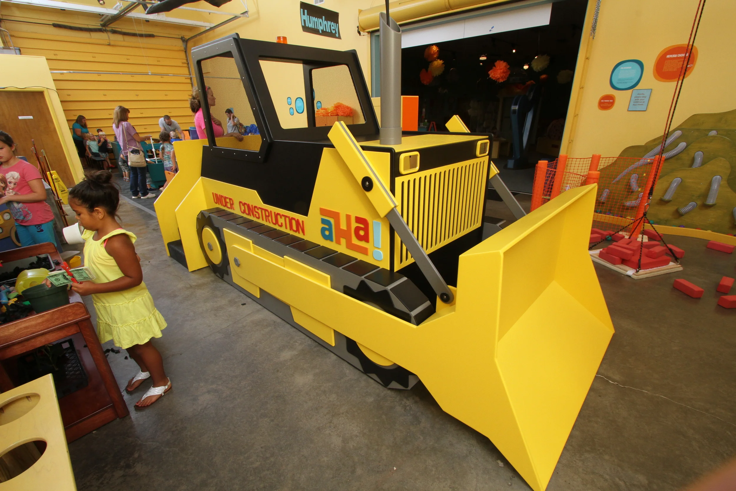 BULLDOZER Get your safety hat and goggles on. Hop on in and work the controls. Sponsored by Company Wrench