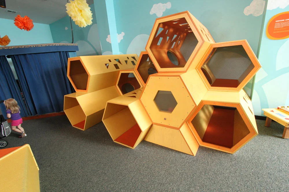 HONEYCOMB CLIMBER Unique structure shaped like a honeycomb. Created especially for you to crawl and climb around in. Go to the peek-a-boo window to be surprised. Sponsored by The David Johns Family