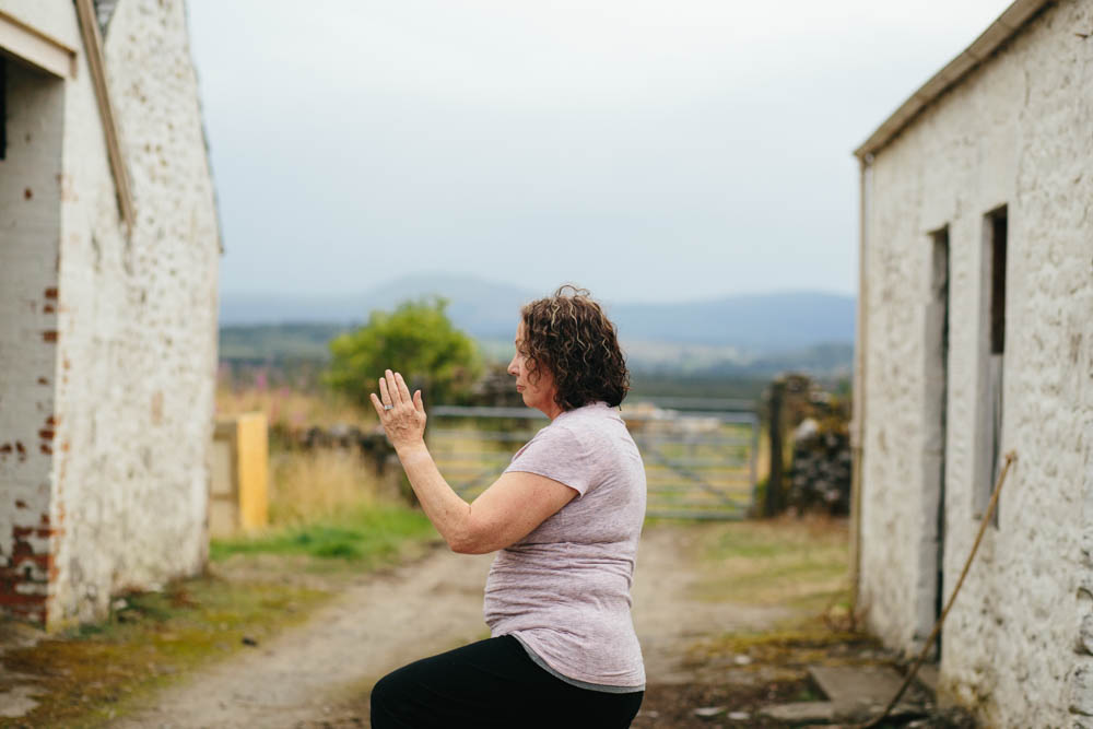 My mom doing Tai Chi in my courtyard. 