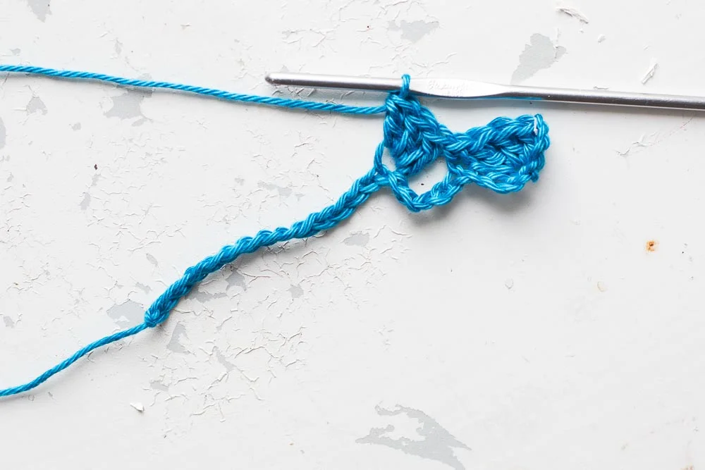 Step 3: Miss 5 chains and make 3 trebles in the next chain.