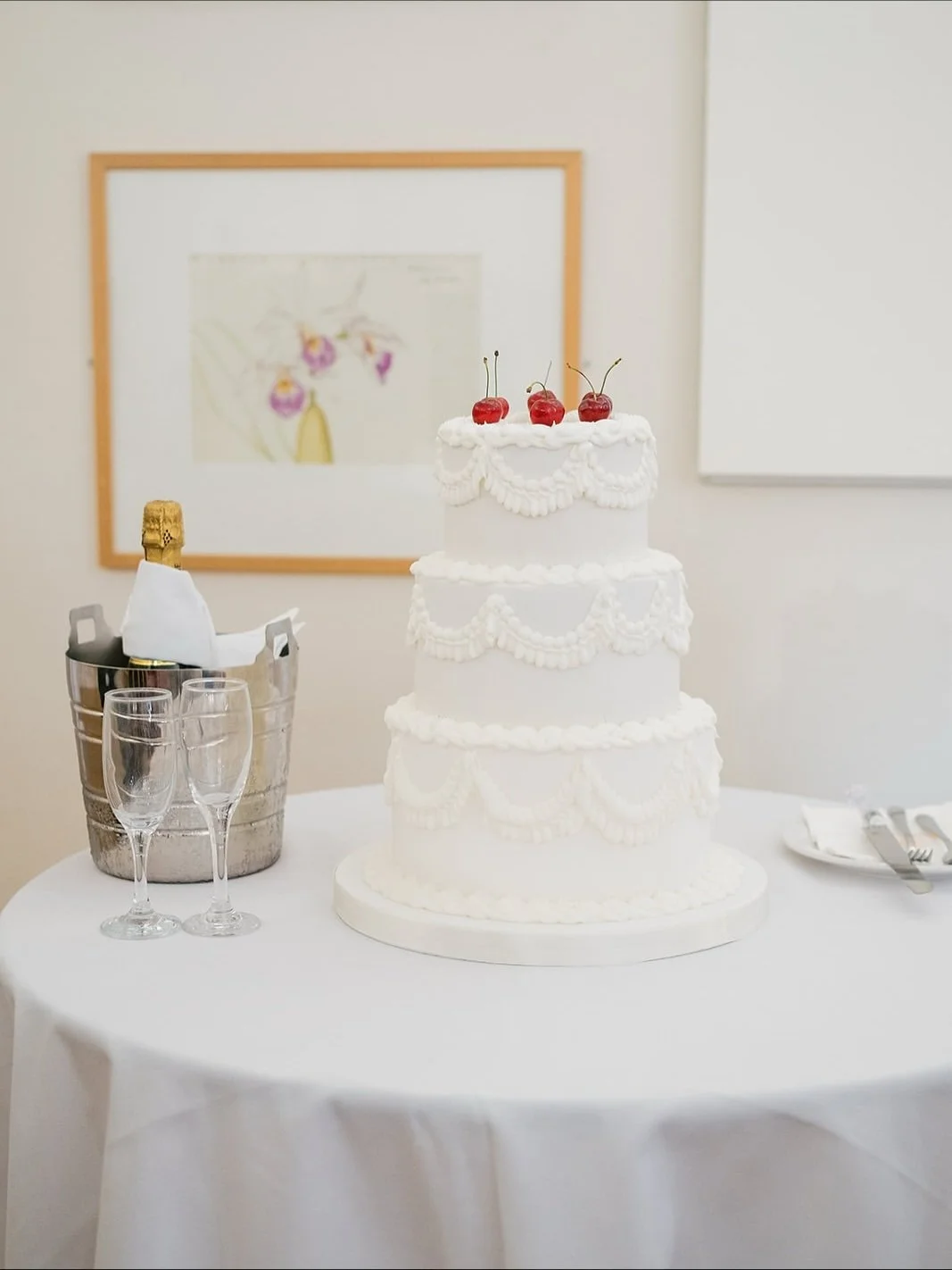 White lambeth iced wedding cake with cherries