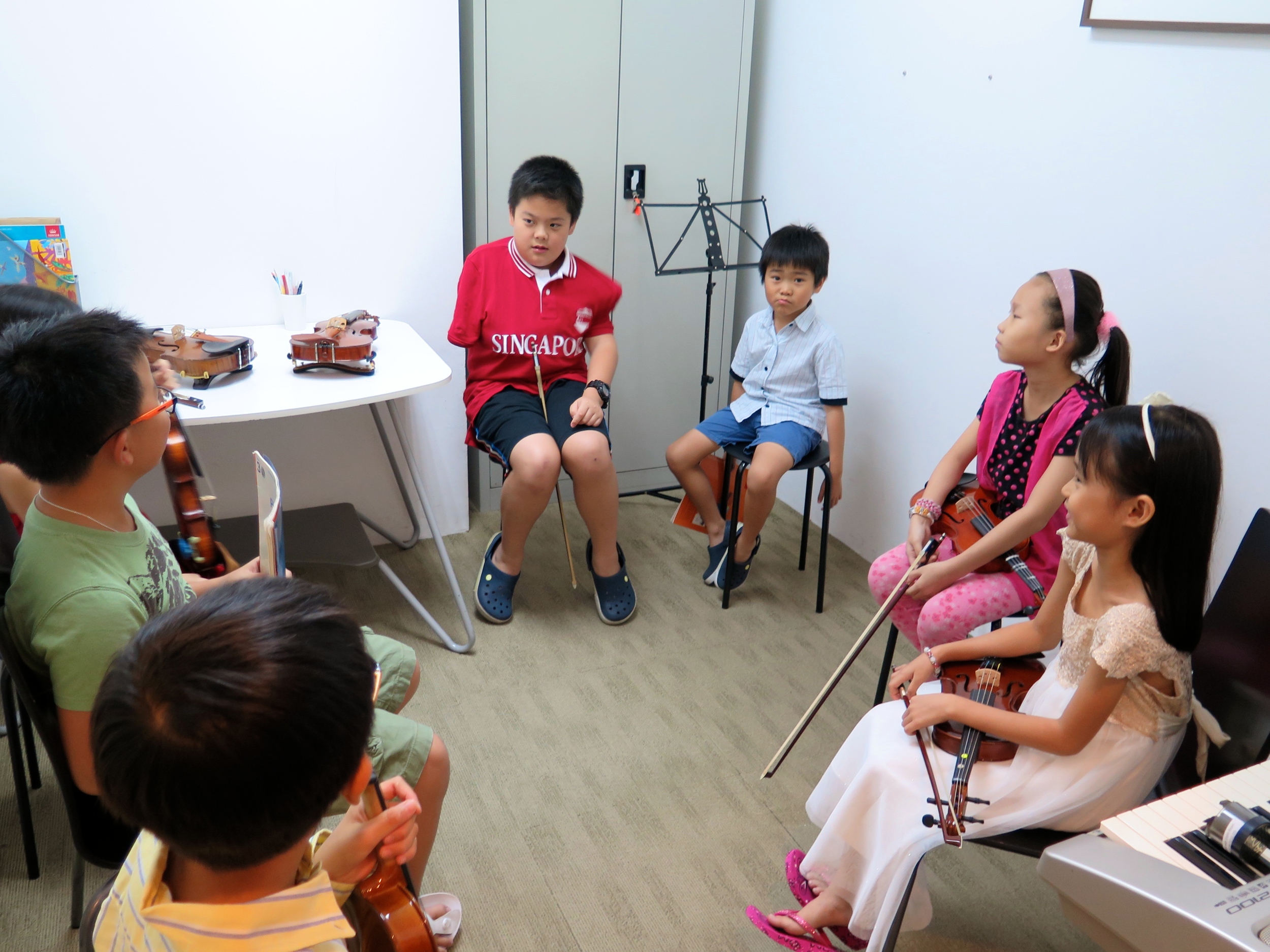 Our performers ‘discussing’ who should go first, not knowing that the order was decided long ago by their teachers!