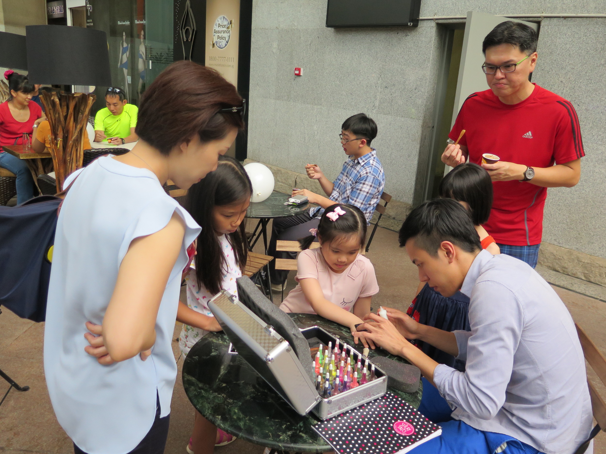 The multi-talented Yong Jie, a familiar face at The Music Suite, applying glitter tattoos for the kids!