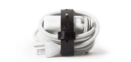  If you travel with a carry-on, you'll want this simple handmade  leather cord bundler  