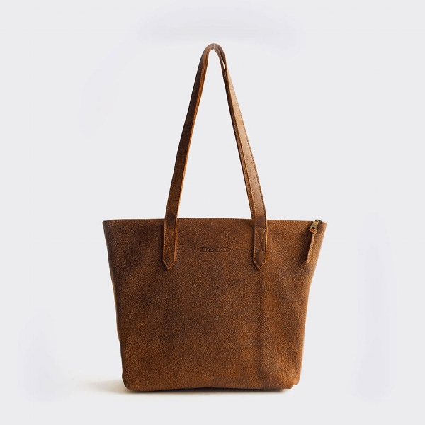  This  Rowdy leather bag  will go everywhere with you. It's the perfect size for day-to-day and for bringing on longer trips. 