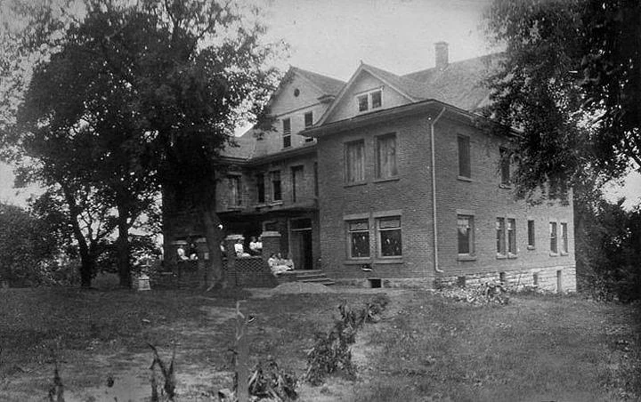 Very early undated photo of Edgewood. The building was constructed in 1909 and it is evident that this image shows a work-in-progress. The sidewalks are not completed. Scanned by Rich Gaulke, December 18, 2014, from the collection of the Iowa Falls Historical Society at the Dow House, Sue Crotty, photo curator.