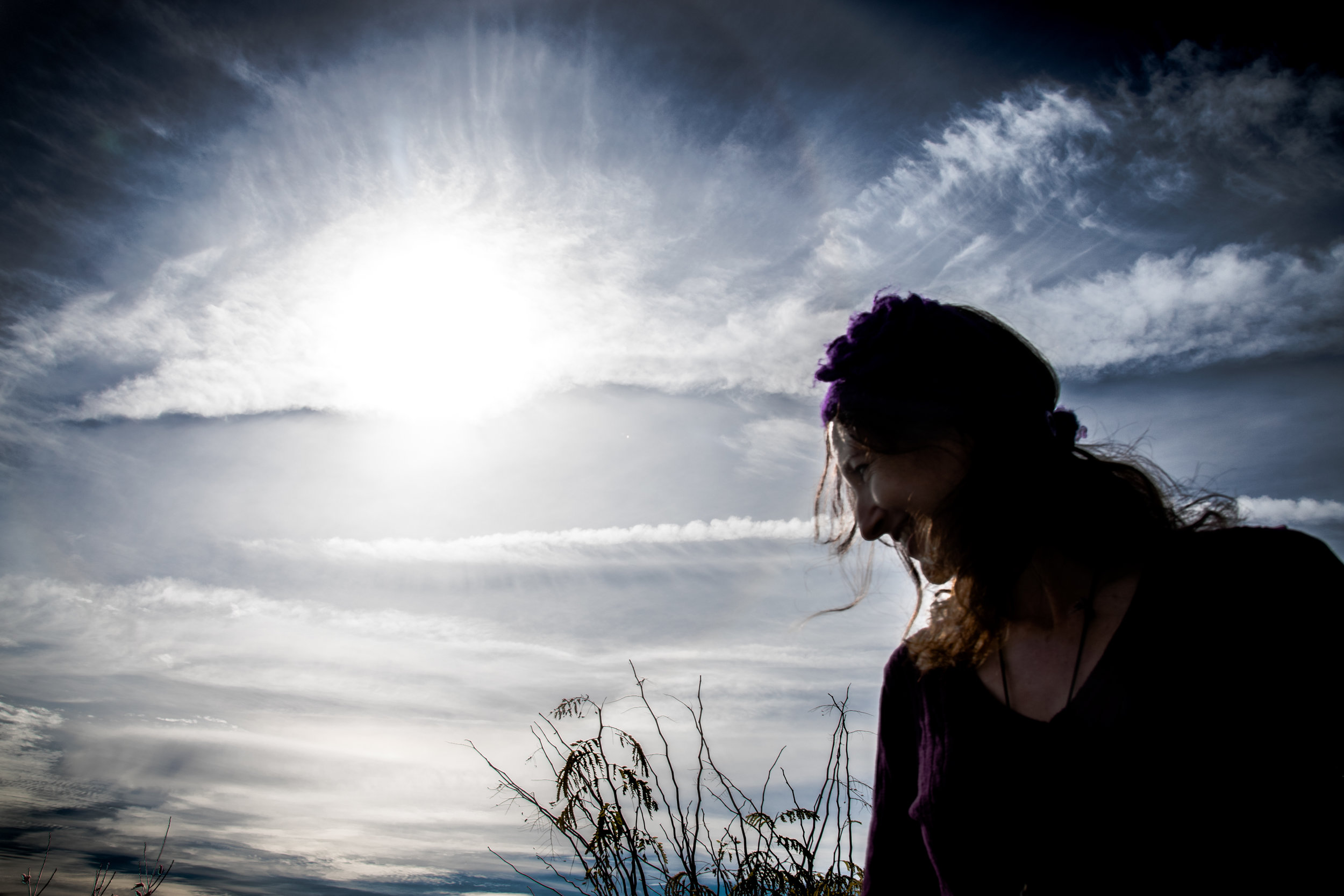 Woman in Profile Against Dramatic Sky