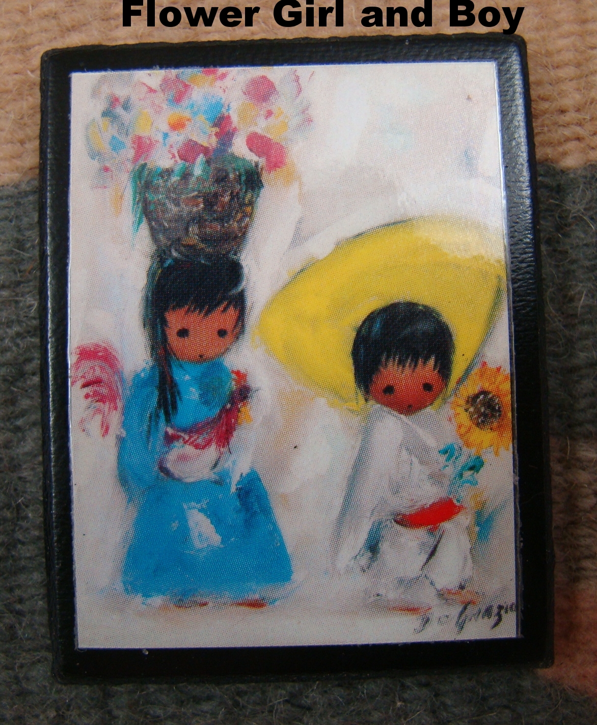 DeGrazia Magnet of a woman with a child in a sling.