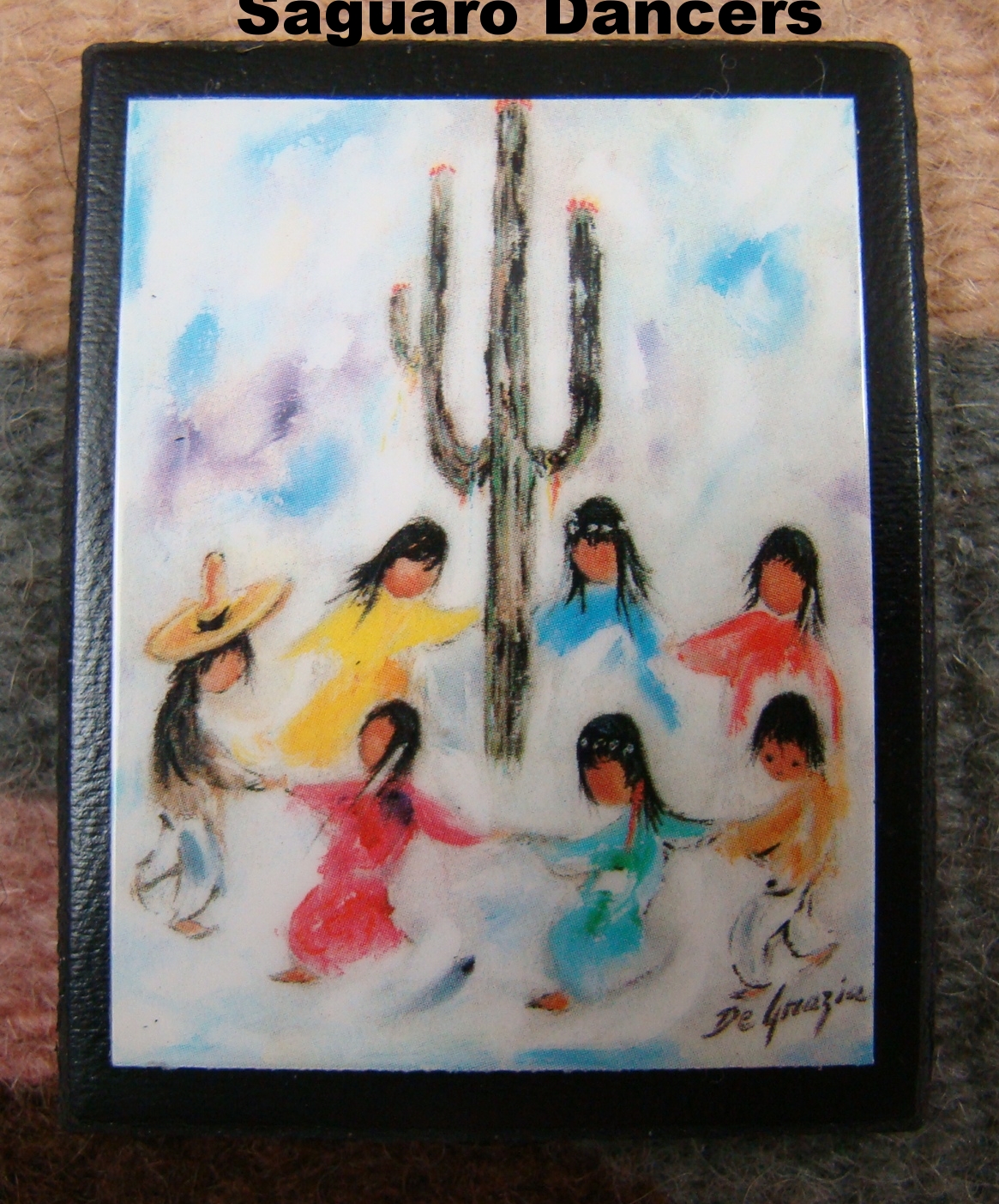 DeGrazia Magnet of a woman with a child in a sling.