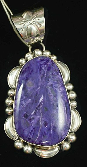 large-navajo-purple-charoite-repousse-silver-moons-pendant.jpg