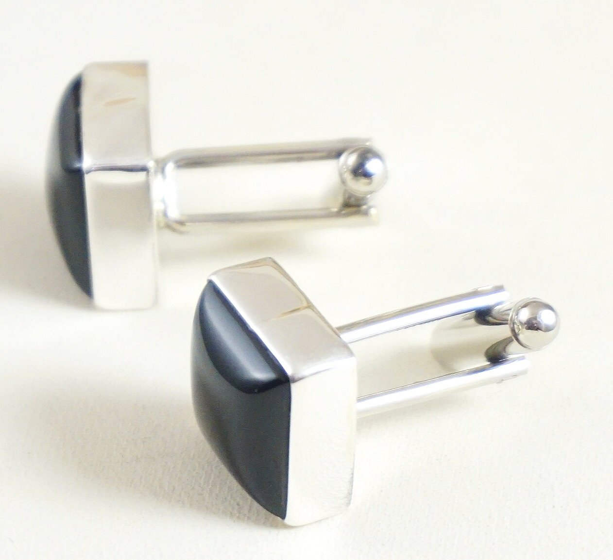 Cufflinks silver colour metal and decorated with black stone 