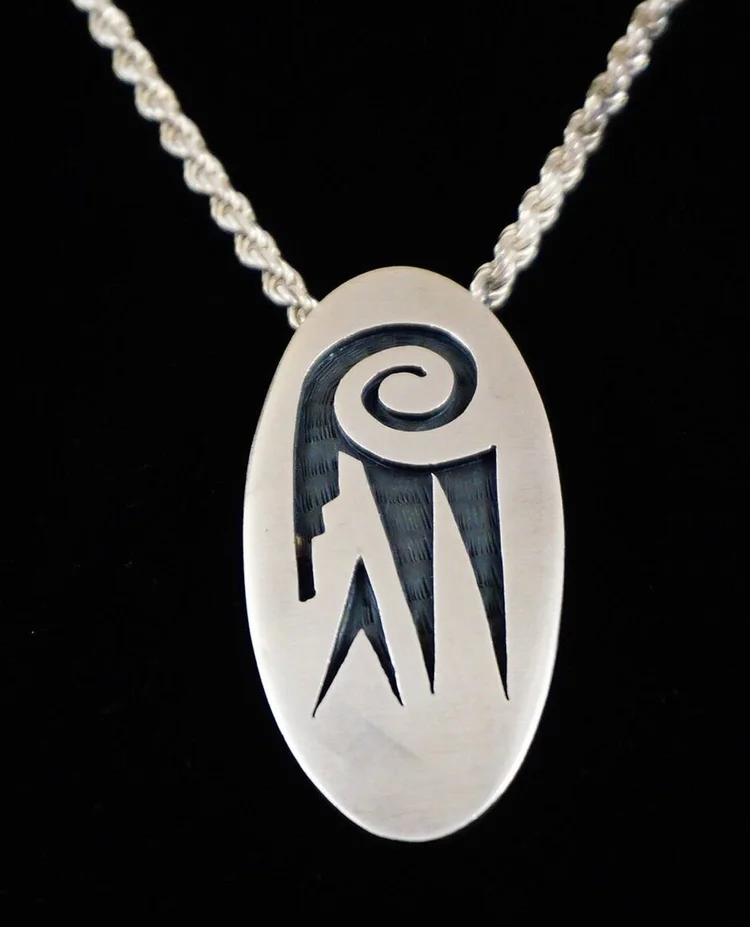 Item #963H- Hopi Oval Parrot Symbol Sterling Silver Overlay 