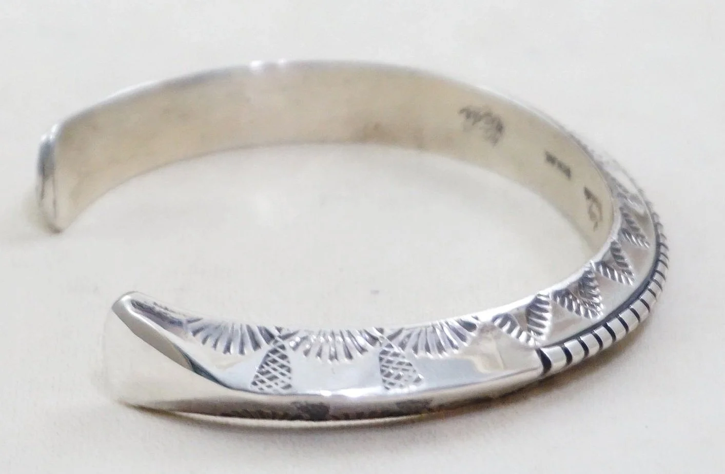 Item #1027W- Heavy Solid Stamped Thunderbird Tracks Sterling 