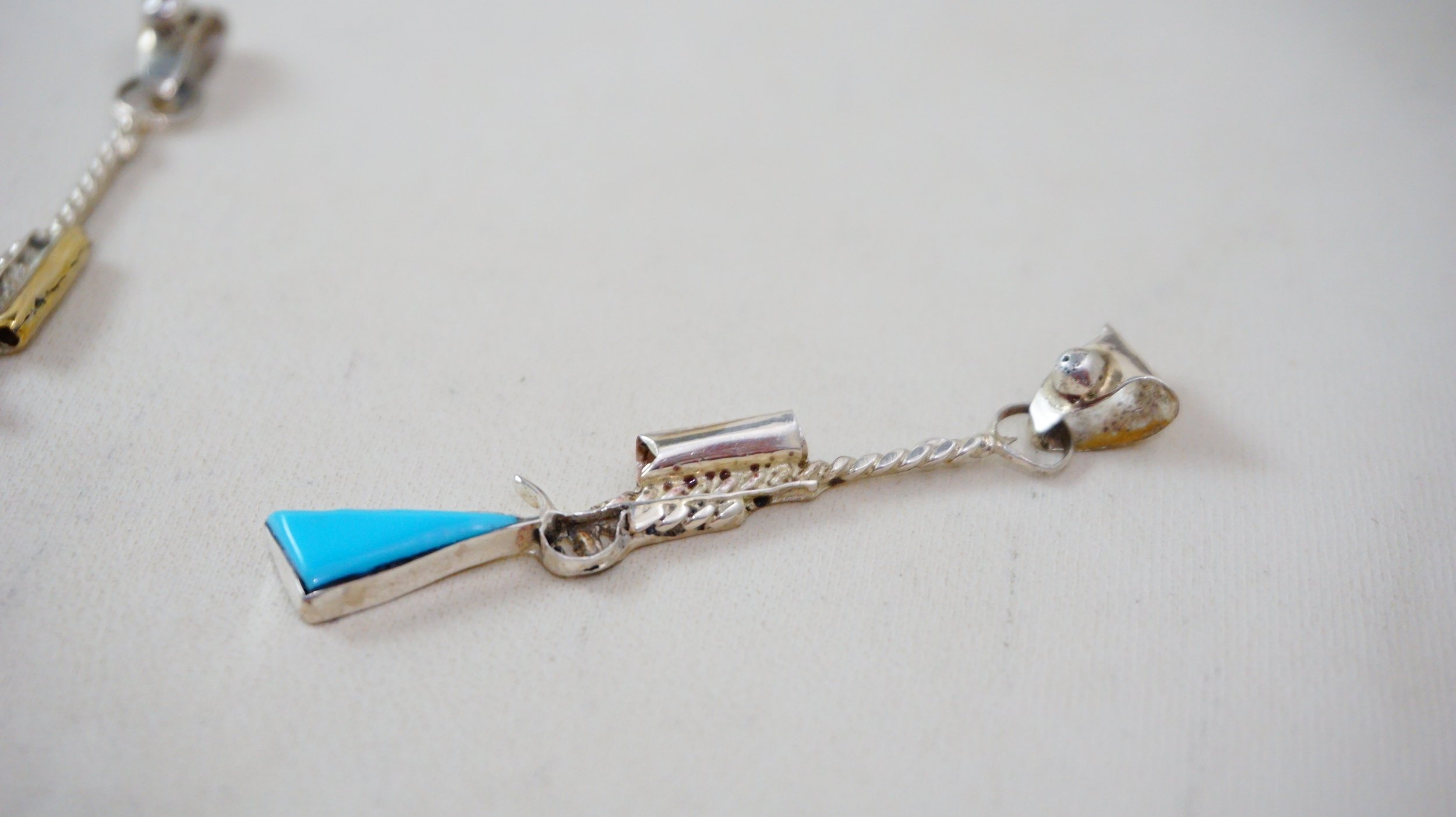 zuni-turquoise-sterling-silver-riffle-pendant-tsethlikiai-1039H-1.JPG