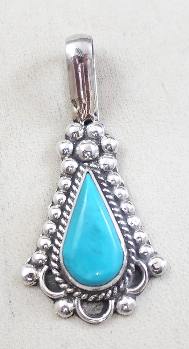 zuni-turquoise-sterling-silver-teardrop-pendant-yatsattie-1073P-.png