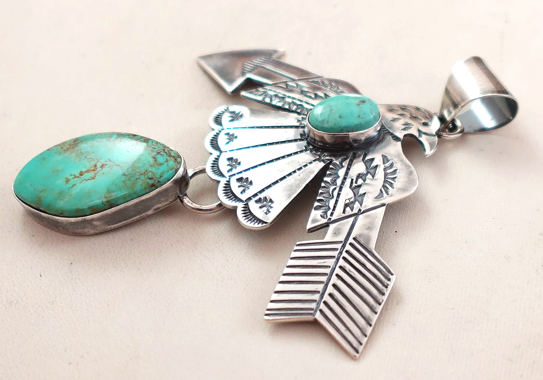 navajo-turquoise-silver-eagle-arrow-pendant-teller-1077M-1.png