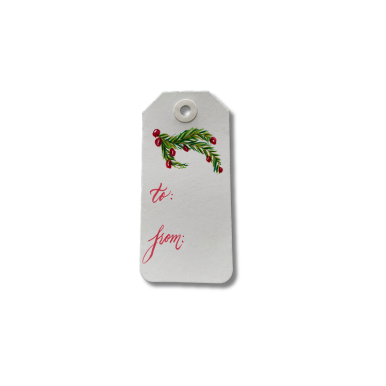 White Christmas gift tag with a hand-painted wreath and red lettering