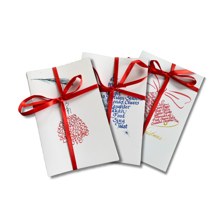 Christmas card bundles tied with red ribbon