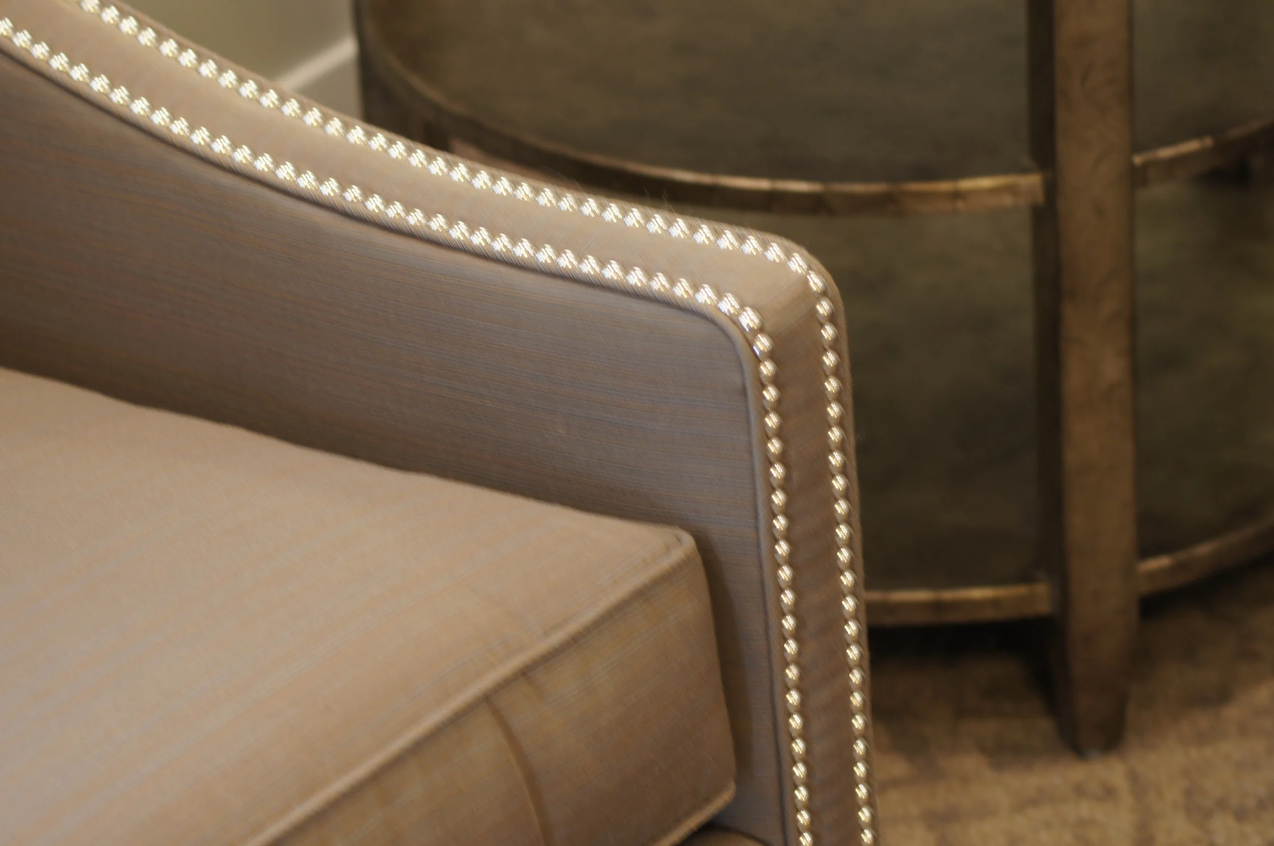 STAINLESS STEEL NAIL HEADS DRESS UP MANY OF THE FURNITURE PIECES