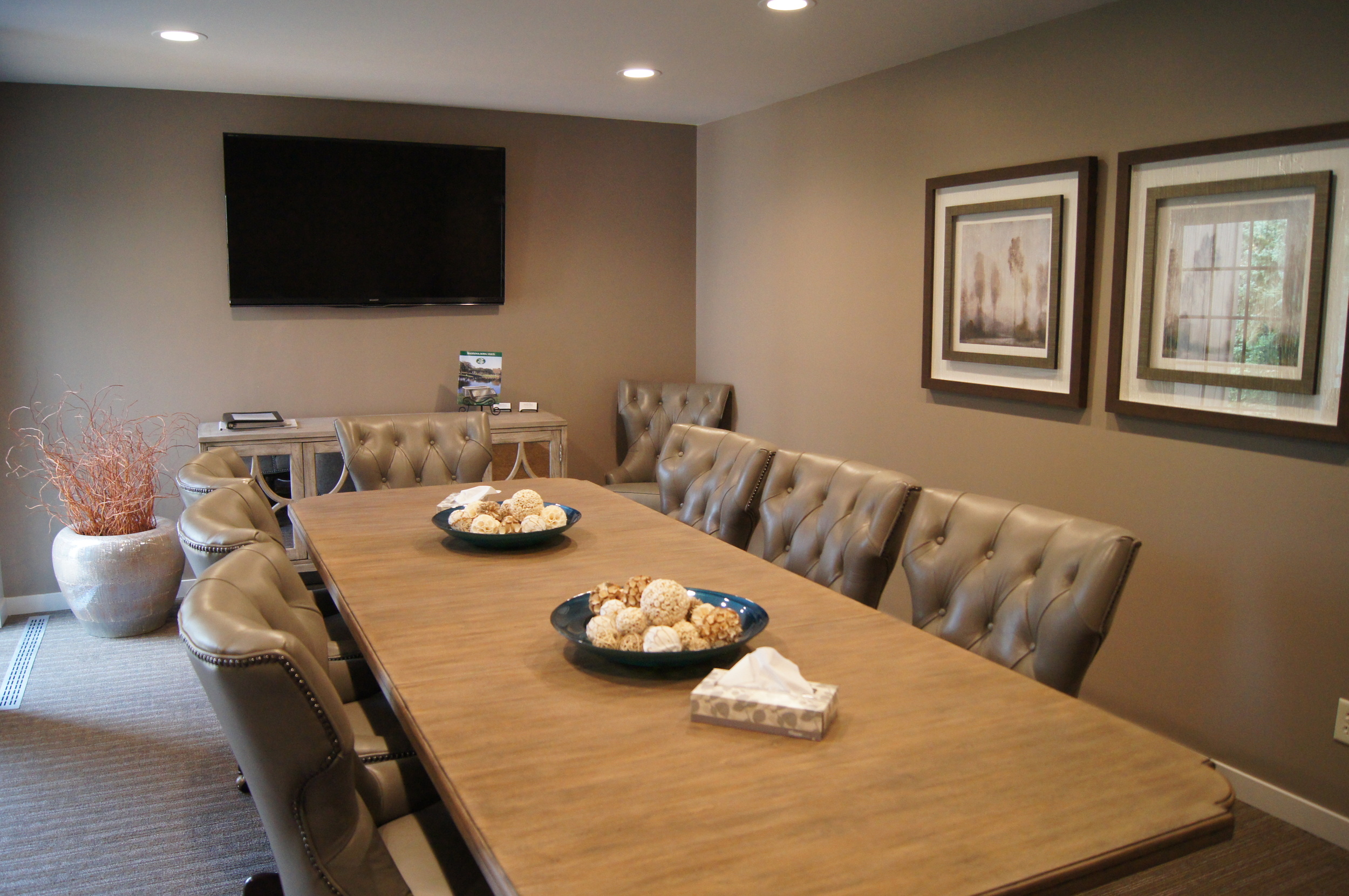 AFTER: ARRANGEMENT ROOM A LARGE BOARD ROOM STYLE TABLE WAS ADDED WITH 10 DESIGN-DRIVE, YET FUNCTIONAL OFFICE STYLE CHAIRS.