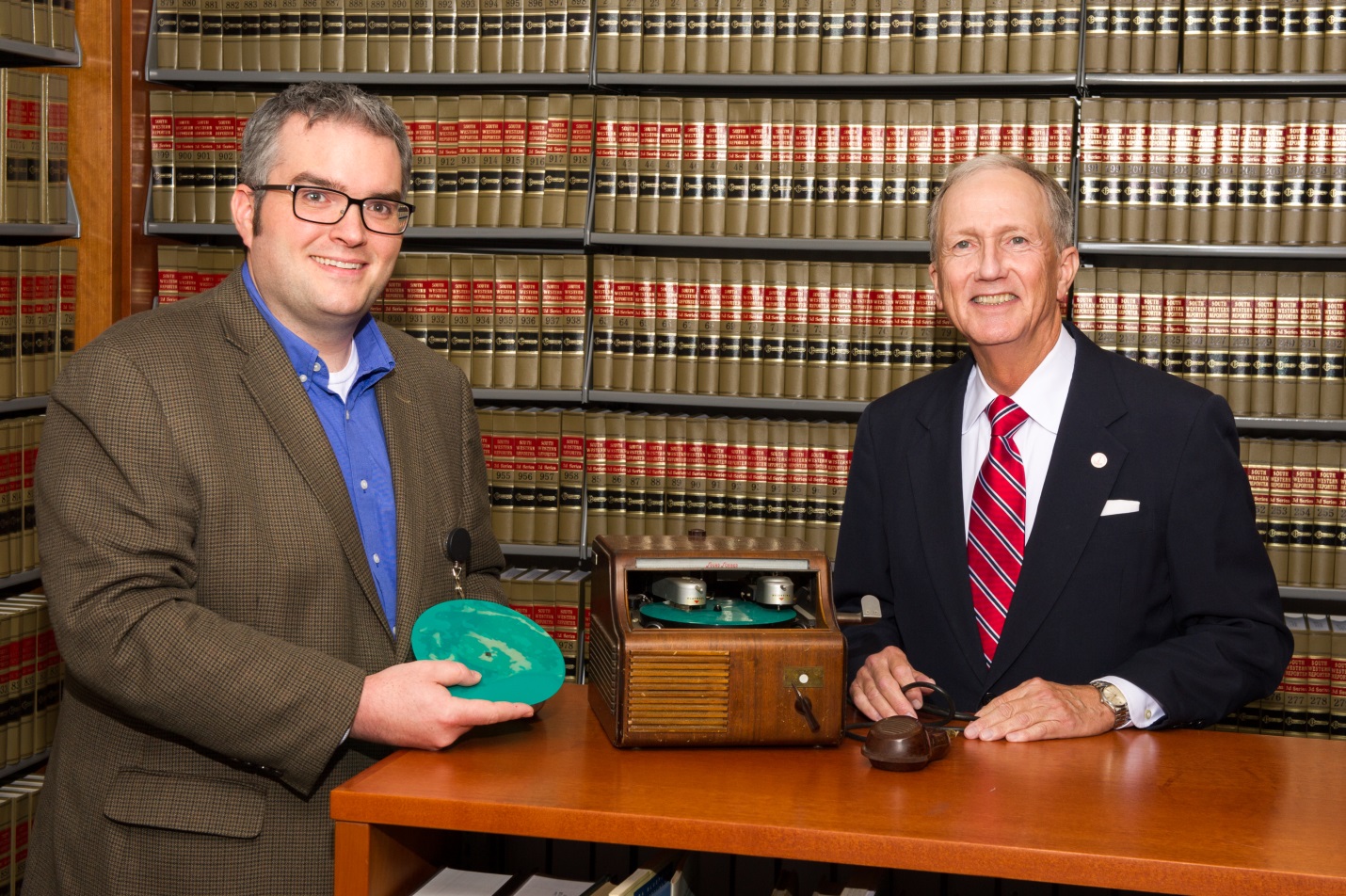 Law Library Deputy Director Joseph Lawson and Harris County Attorney Vince Ryan with a 1940s soundscriber machine. 