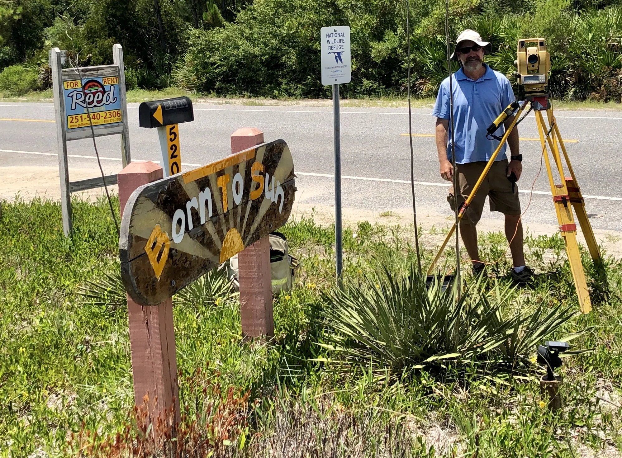 Surveying with the heat index at 105. The sign says it all!
