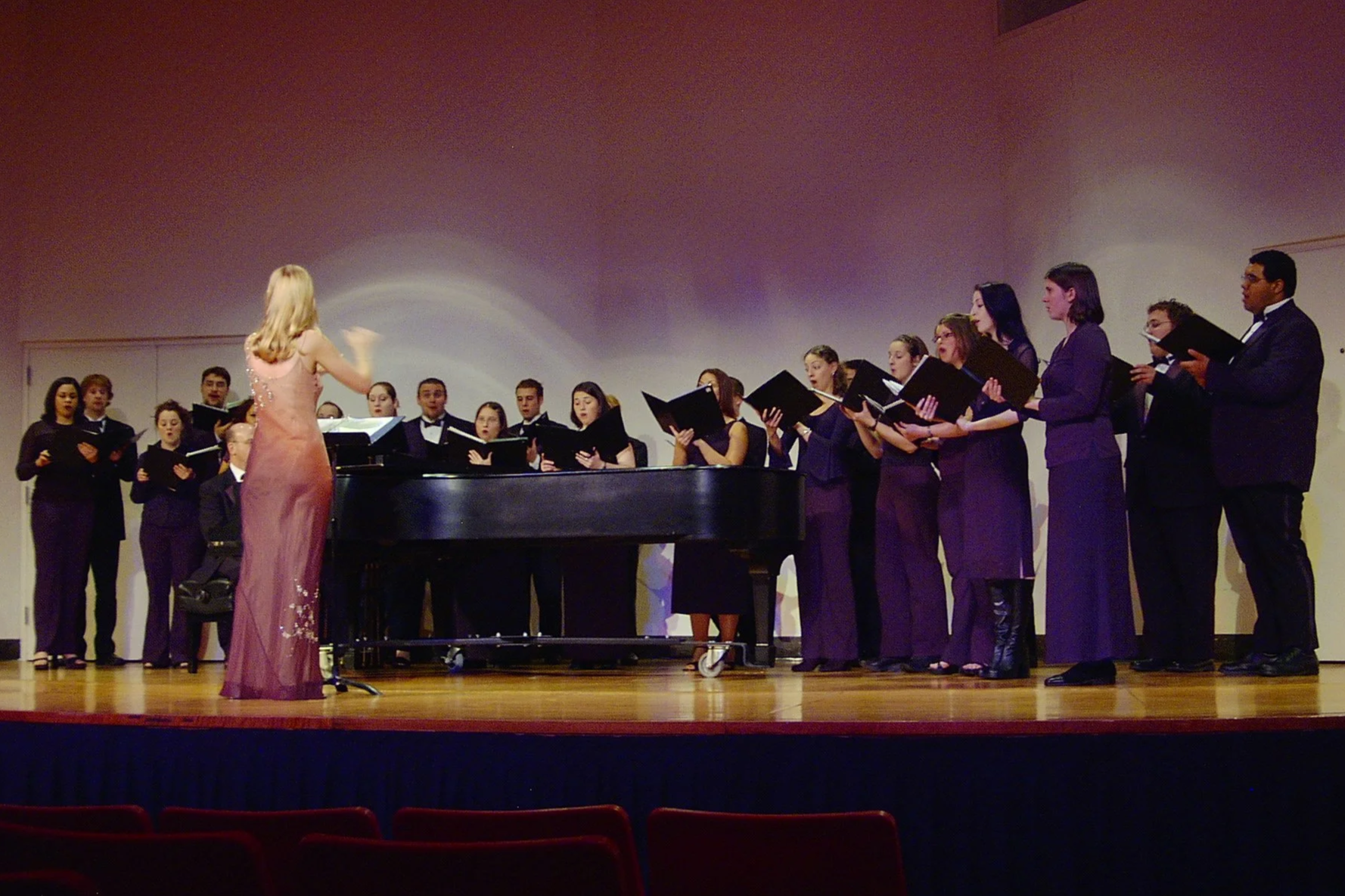  Conducting original pieces sung by the Otterbein Vocal Ensemble, Sr. Music Composition recital, 2003. 