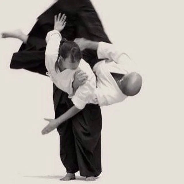 bw woman flips man.jpg
