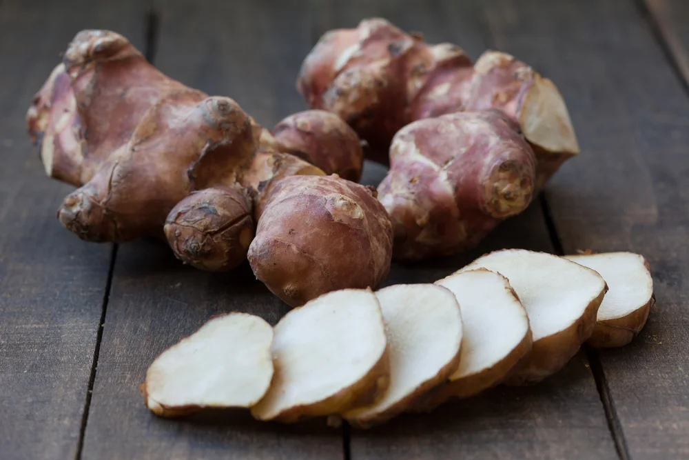 Sunchokes are the tubers of a plant in the sunflower family. They have been gaining popularity among restaurants, so you can often find them now in farmers markets around urban centers. Though they are gnarly on the outside, they peel relatively easily with a sharp knife and cut smoothly.