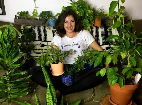 Maria of Bloom & Grow Radio in her element: surrounded by plants! 
