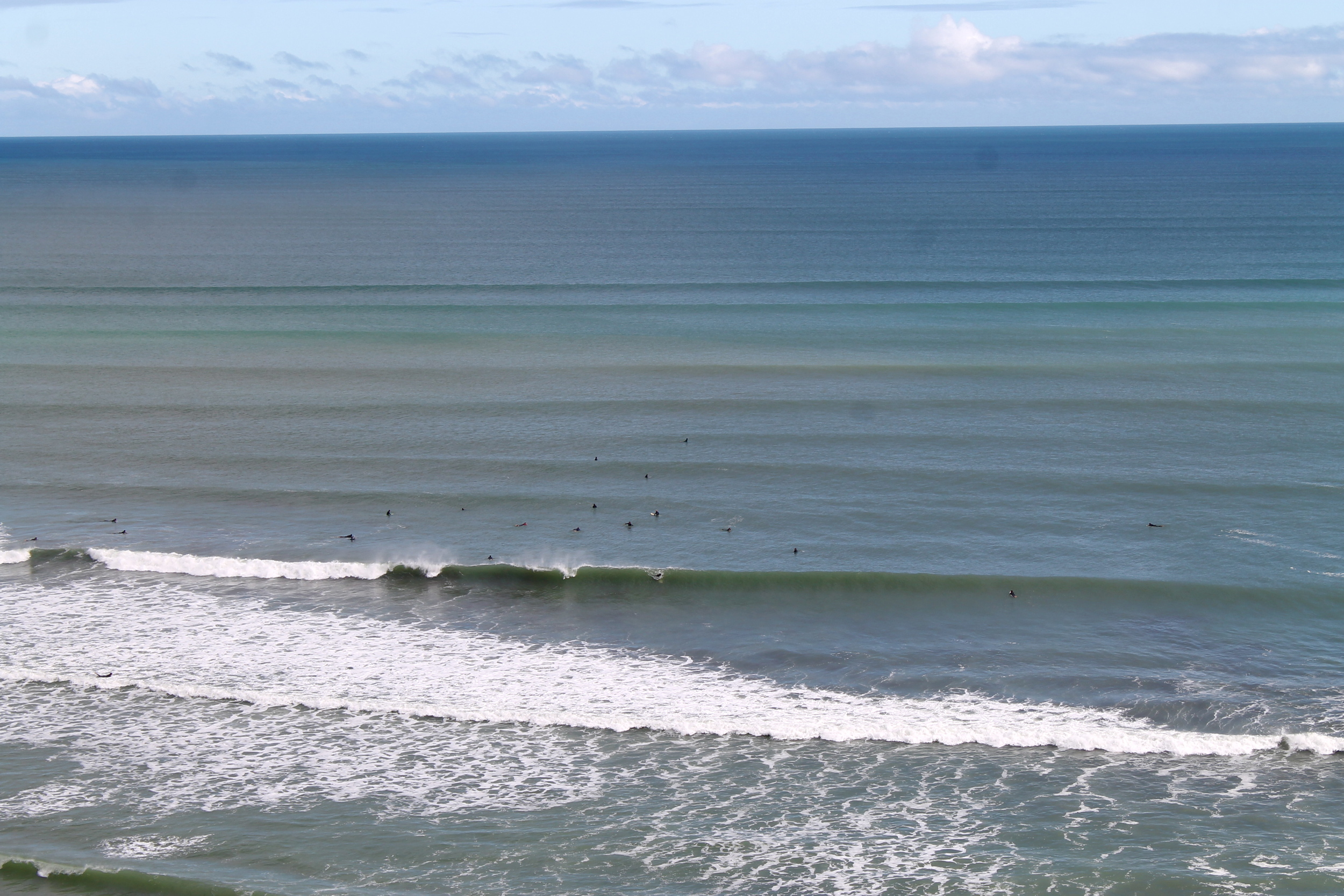 Note the tiny specks of surfers. 