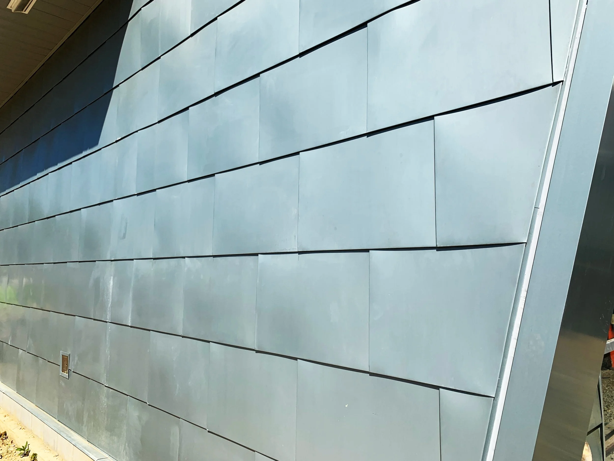 The exterior has been covered in zinc metal panels, imported all the way from Germany.