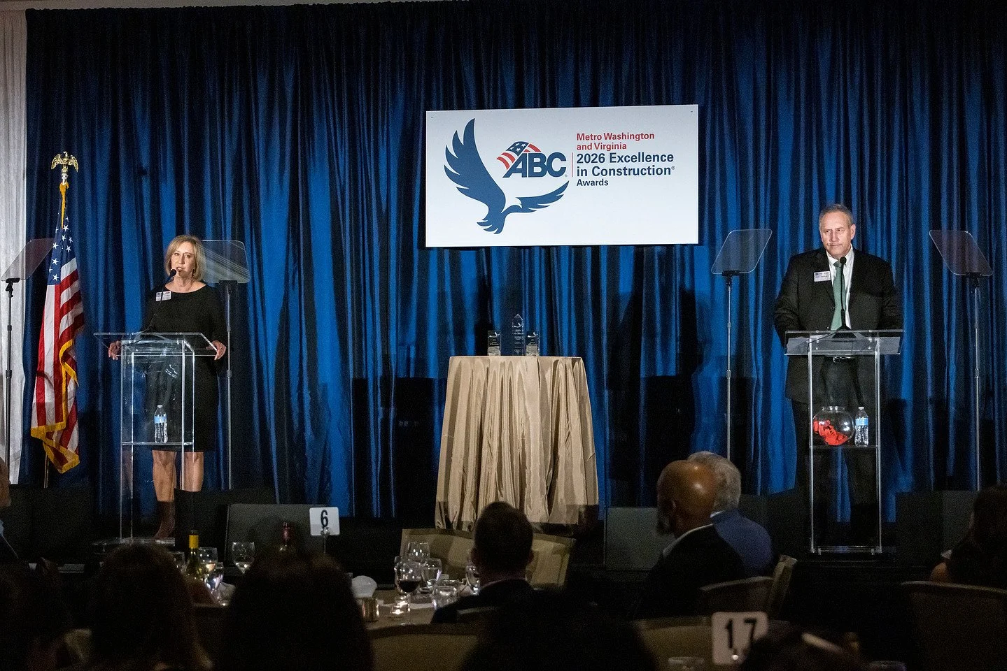 CEO Lynn Stith Bennett and President Greg Harraka take the stage during the ABC Metro Washington Excellence in Construction Awards