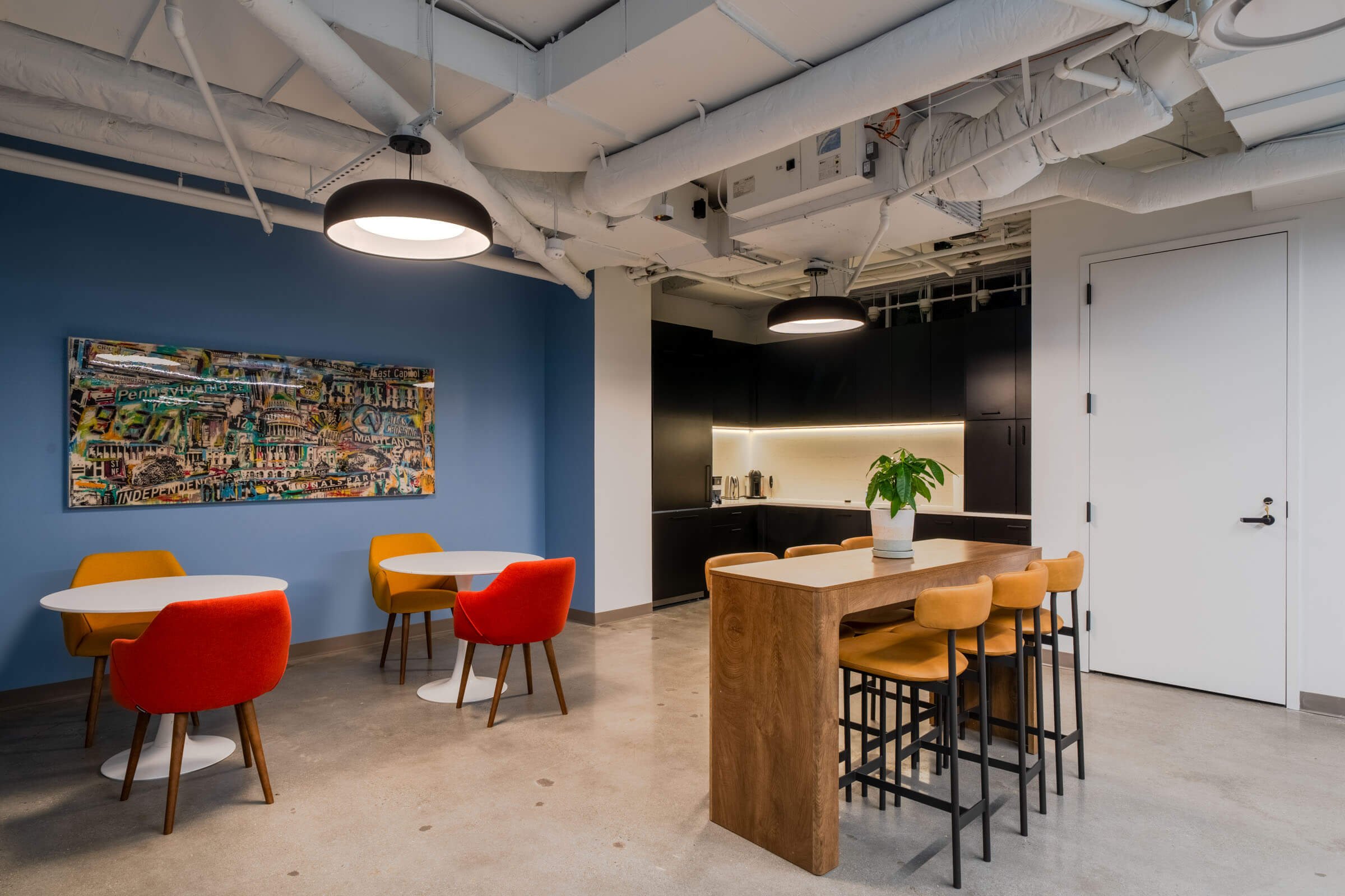 Light-filled corporate office atrium featuring expansive glass walls and modern architectural design.