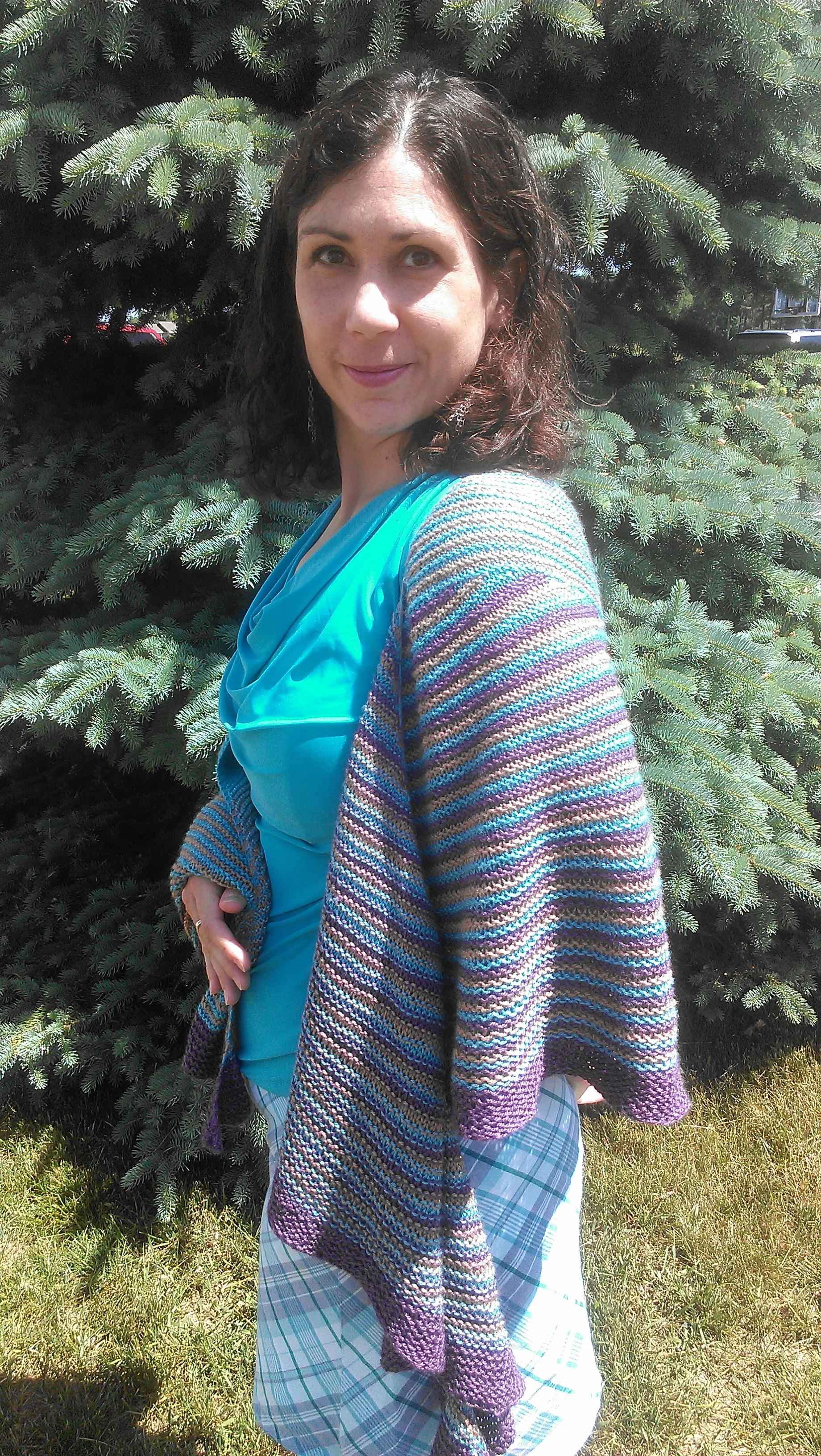Jenn modeling a shawl she knit