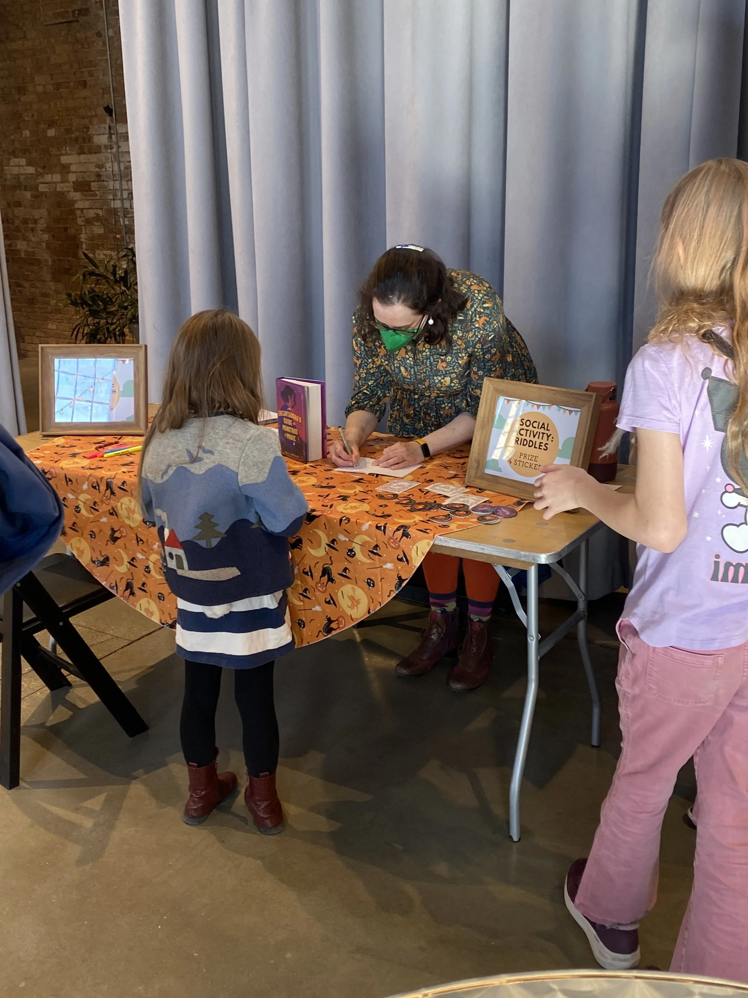 Sarah J. Mendonca signing at the Garver Feed Mill Kids' Book Fest