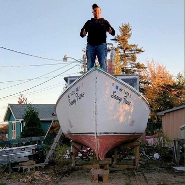 Zachary Floyd on his boat, F/V Sassy frass.