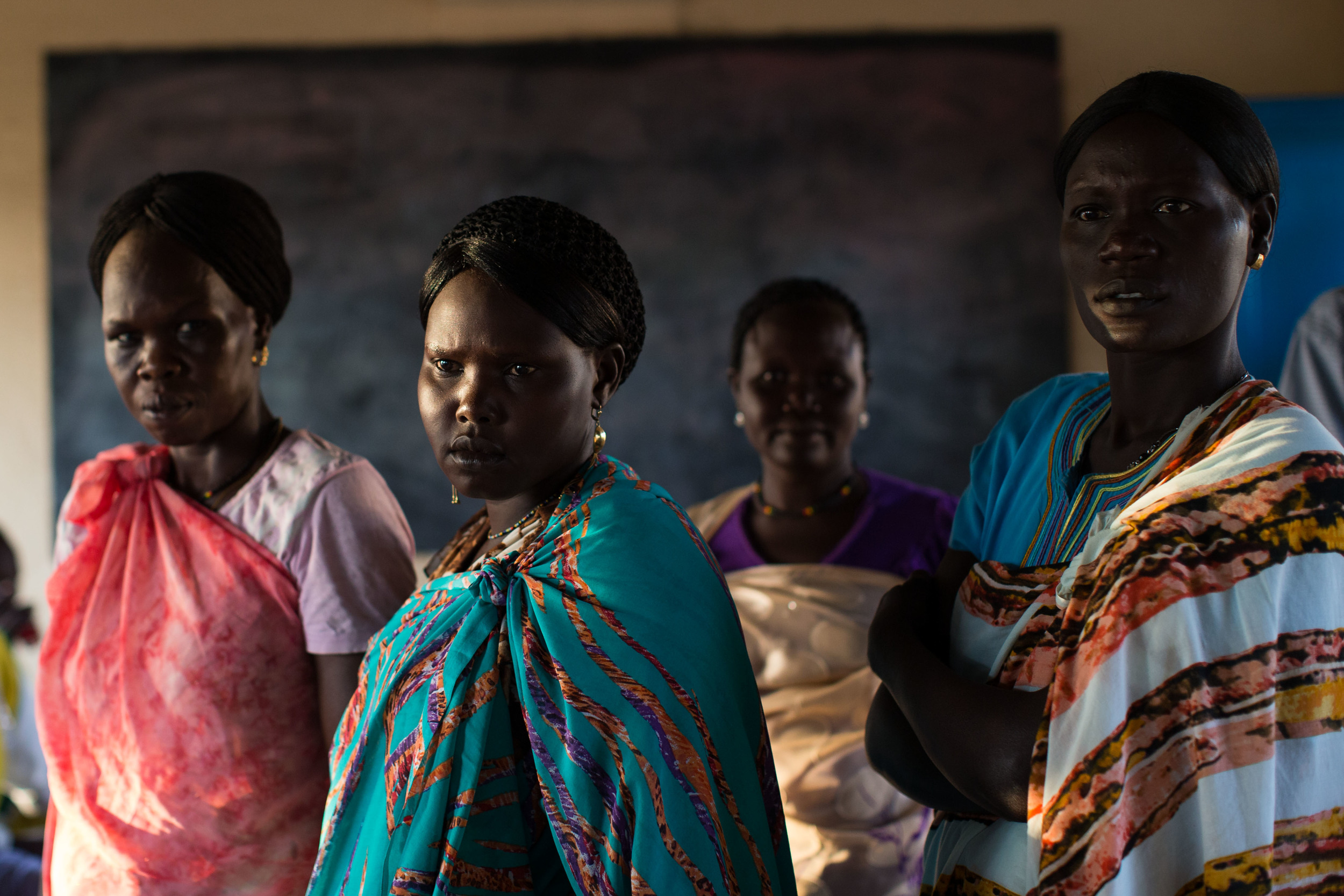  Women wait to vote at an abandoned school converted into a voting center in Abyei. 