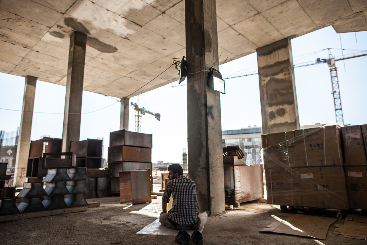 A construction worker prays during his break from work at a construction site in Erbil.