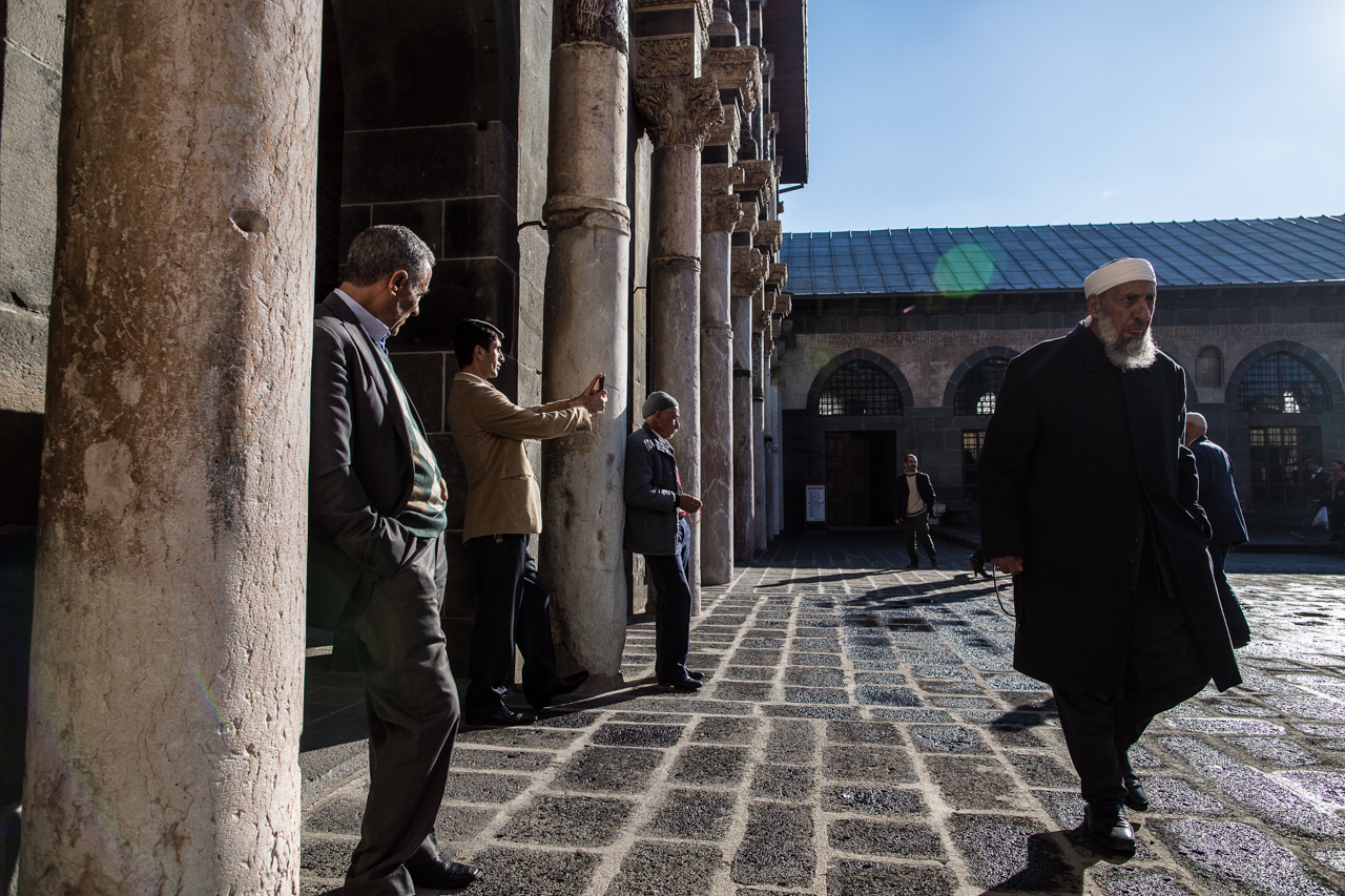 Muslim men walk through the main mosque in the center of Diyarbakir.