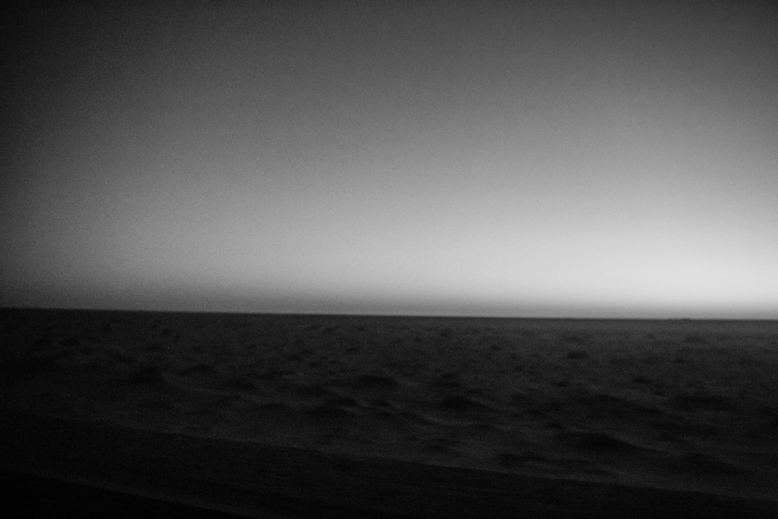 The sun rises over the Sahara as the car speeds north through Mauritania.