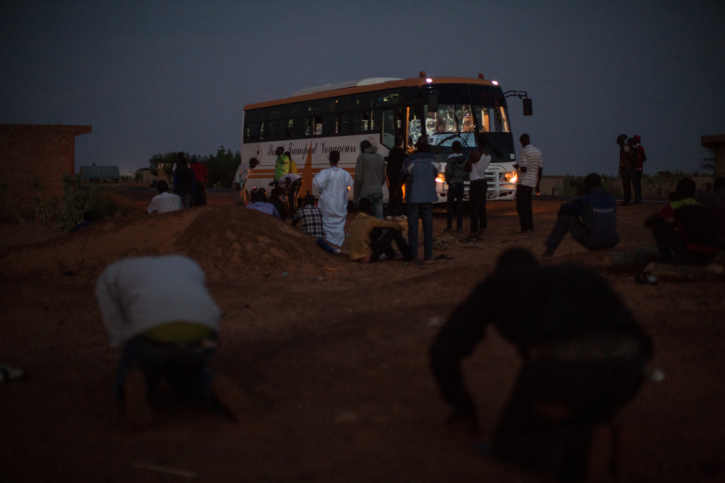 The bus stops in order to allow passengers to pray and rest by the side of the road in Mauritania.