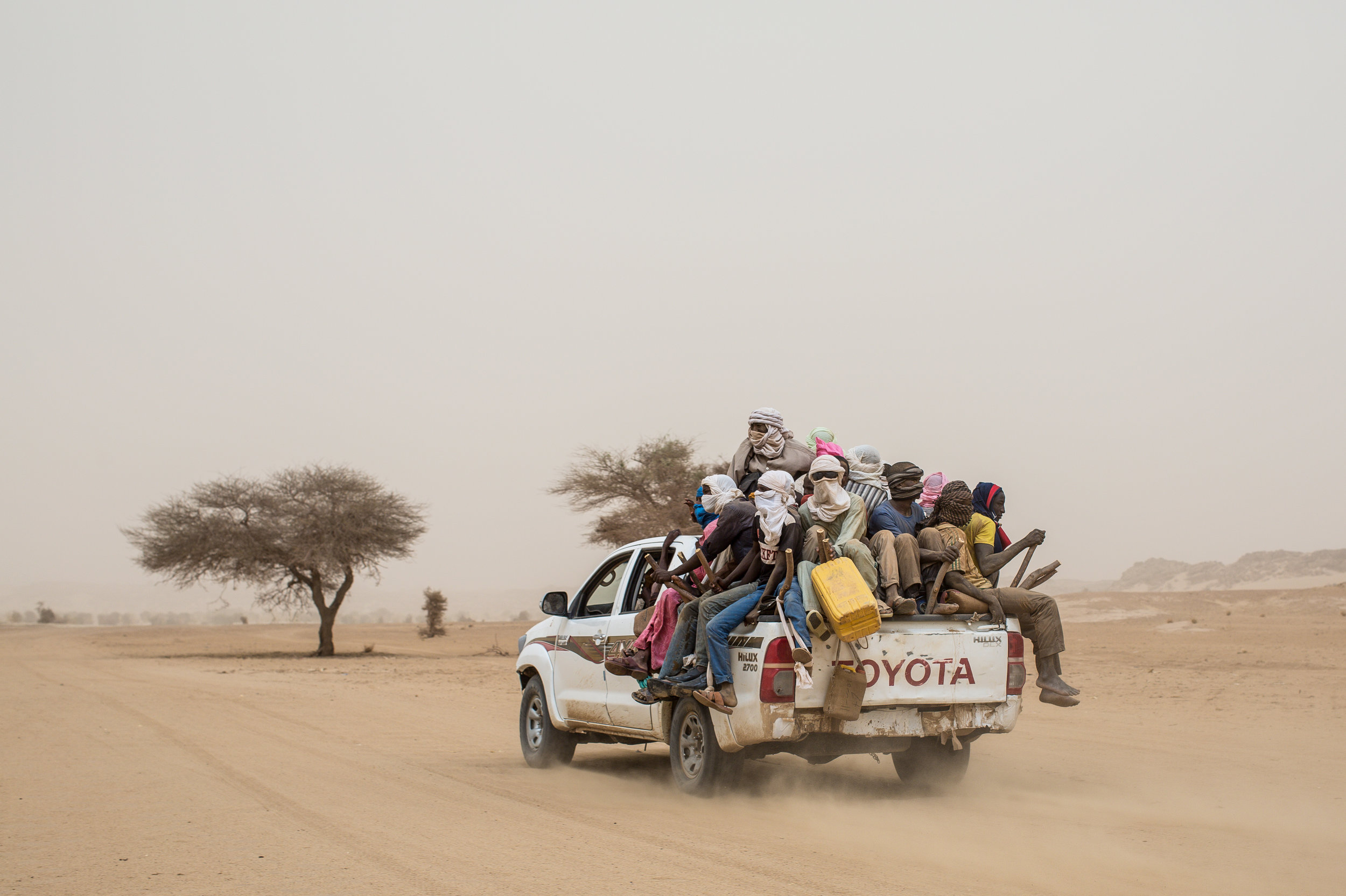 A truck carrying migrants for Libya drove across the Sahara a few hours north of the desert outpost of Agadez, Niger.