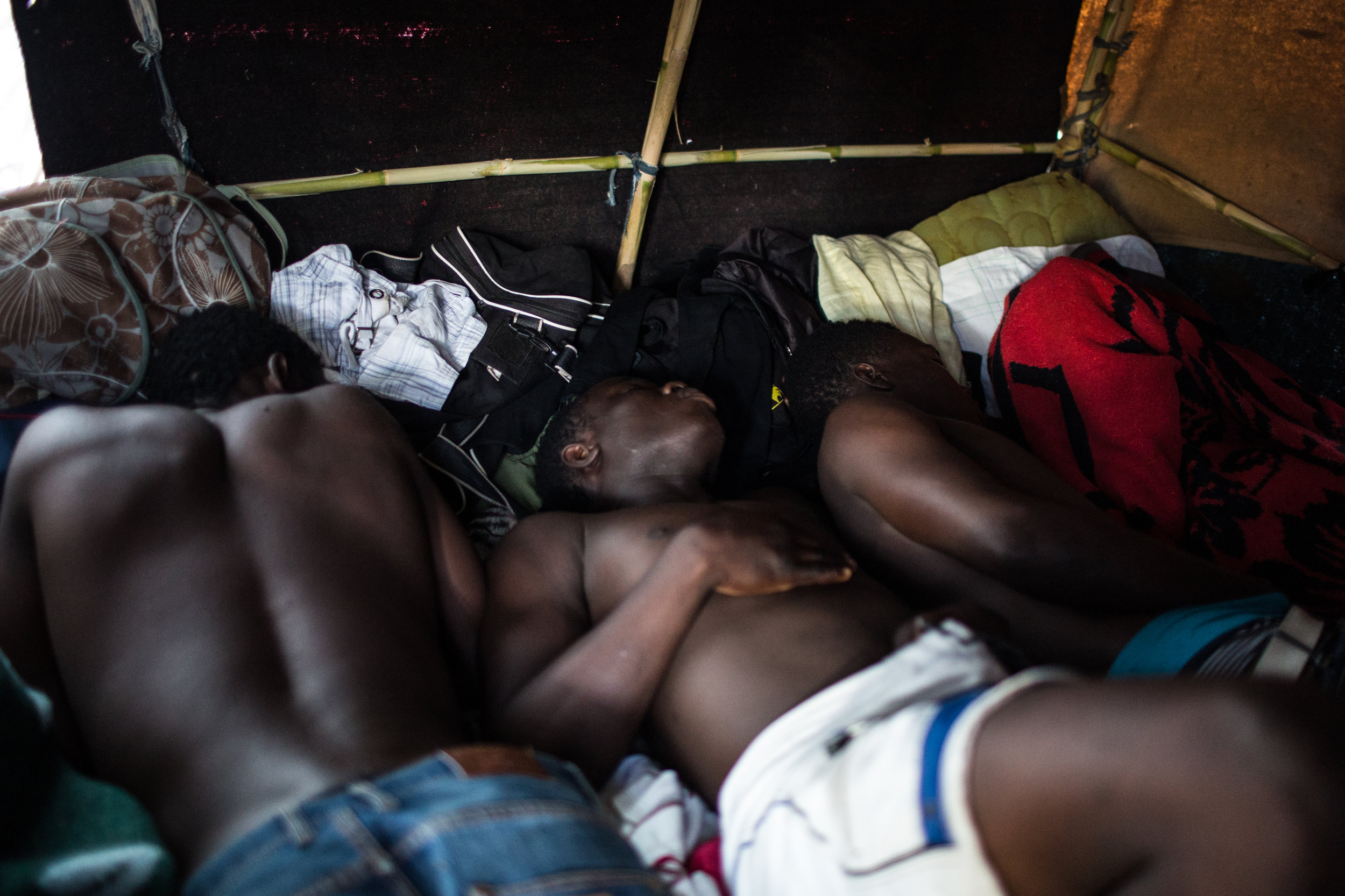 West African migrants sleep in the tent where they've spent the last four months in Tangier, Morocco. Migrants, even those with residency, occupy a tenuous place in Moroccan society with most living along the margins in places that can be destroyed at any moment by Moroccan authorities.