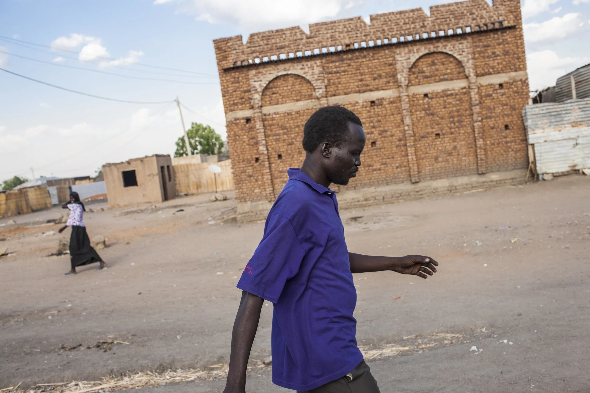 Kuany walks through Renk to arrange plans for getting to Juba. "There is no reason to be in Malakal now," he reflects, "even the basic thing of life we lost in clashes there. Maybe I will return there some day...even if there is security it will be maybe 15 years before we can all live there together again. I have actually said goodbye to that home."