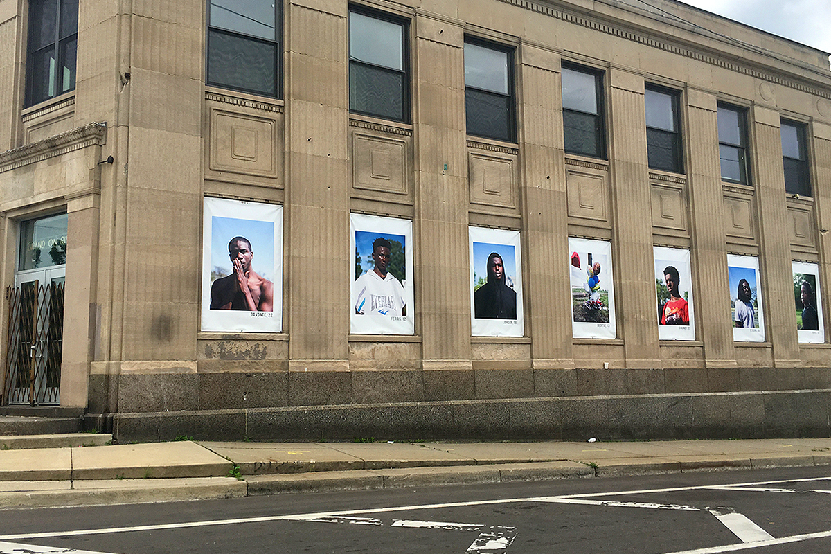Powerful photo installation seen while driving in Detroit. Author unknown.