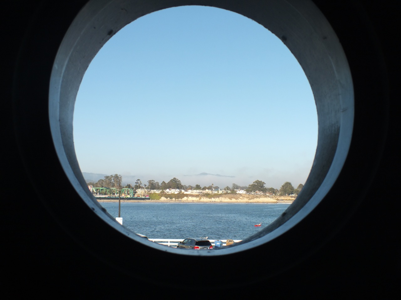 Loma Prieta through port hole window at Olita's Restaurant, Santa Cruz Wharf